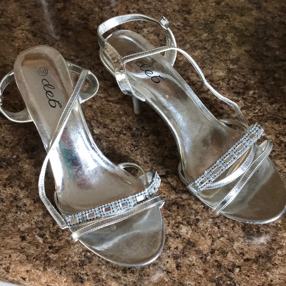 Deb silver high heel shoes. Only worn twice.